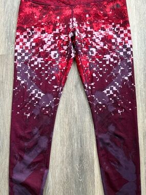 The North Face Red and Burgundy Pixel-Print Active workout tights.